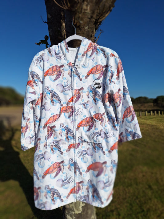 Zip-up wearable towel jacket for kids – swim and surf essential.