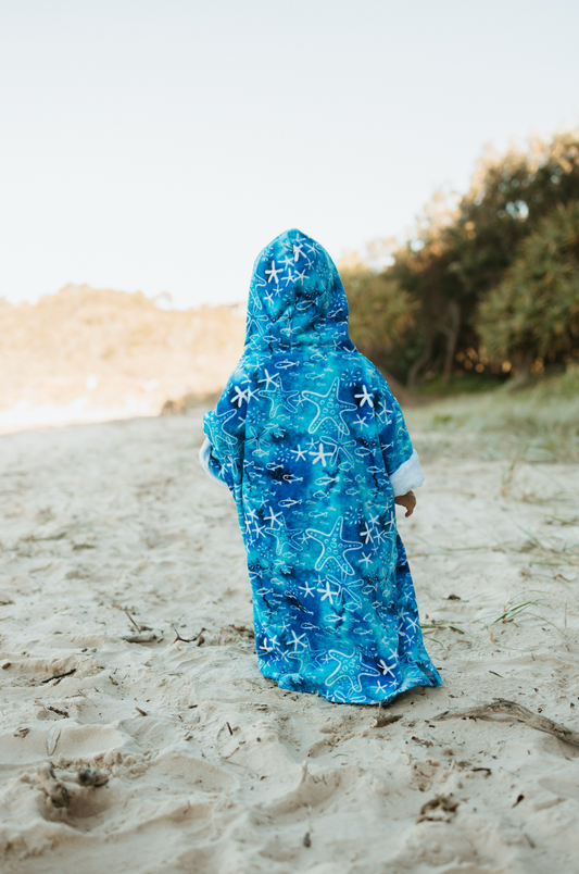 Australian-designed kids wearable towel – coastal style in 100% cotton.